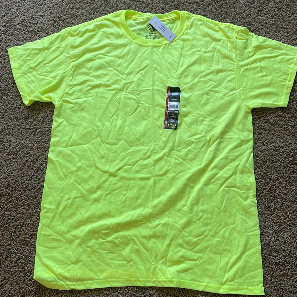 I am selling a neon green shirt, size adult medium (38-40)
